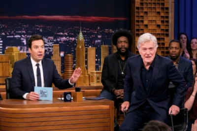 Sometimes a late-night interview stops being entertainment and becomes something else entirely. Robert Redford sat quietly at 82—until Jimmy Fallon shared a story about his dad, a Brooklyn music teacher. Then Redford pushed his chair back, stood up, and pulled out a worn notebook.