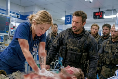 An ER nurse saved a dying soldier’s life with her bare hands. The squad leader wanted to thank her. Then her sleeve slipped 2 inches. He saw the tattoo — and every man in the room went silent, hands drifting toward their weapons. She was more dangerous than all of them.